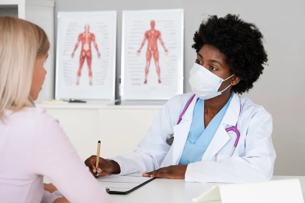 Doctor in side view, wearing face mask and white lab coat, holding medical equipment in hands