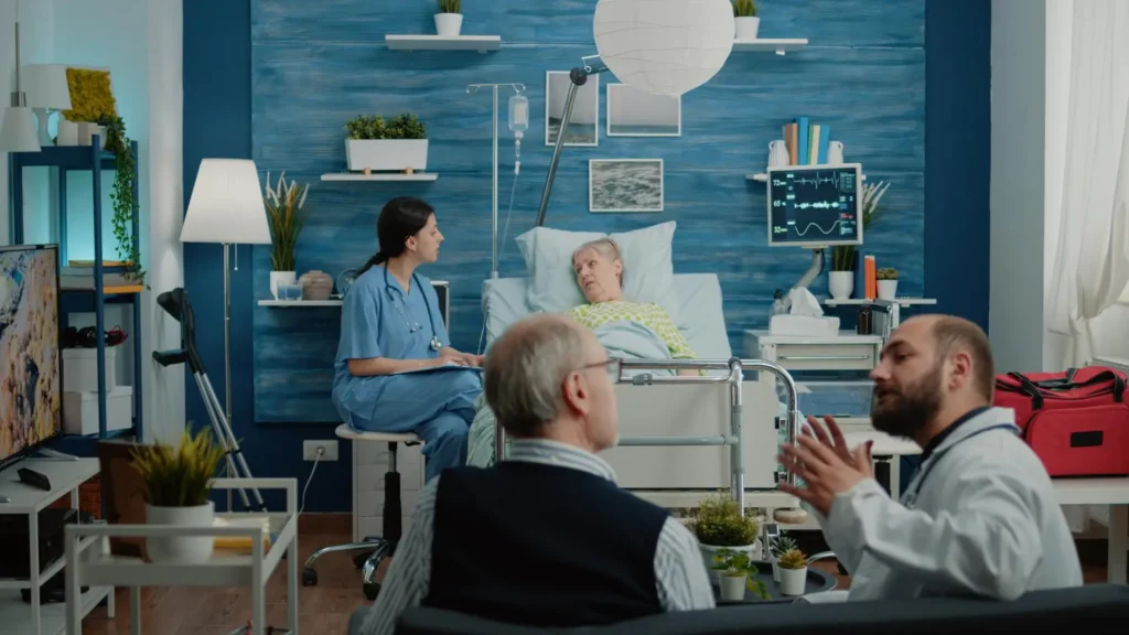 Nurse consulting senior patient about treatment in hospital bed.